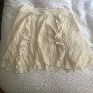 Cream colored mini skirt from Zara with studs along the side! Size M. Worn once